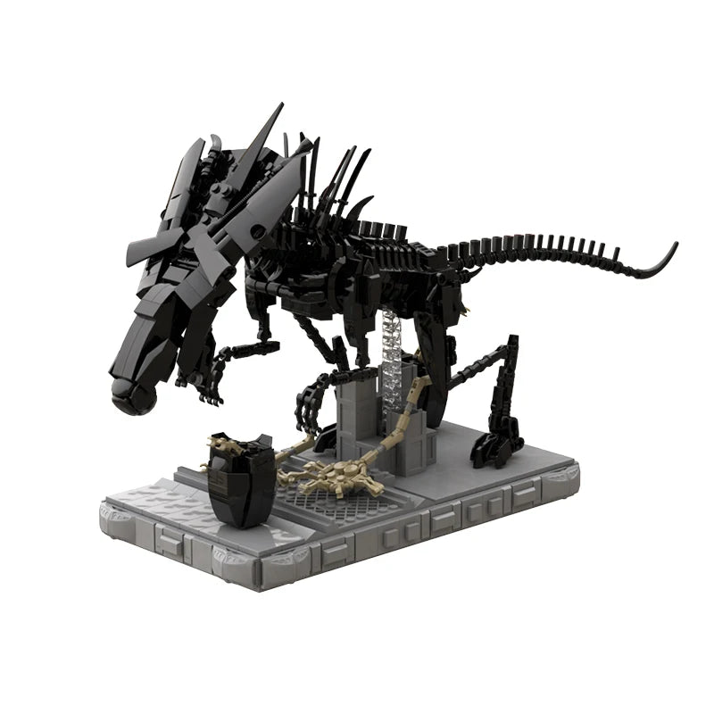 Alien Xenomorph Building Block Model featuring a detailed black Xenomorph figure standing on a grey base, displayed on a wooden desk next to a laptop and a green plant, perfect for sci-fi and Alien franchise fans