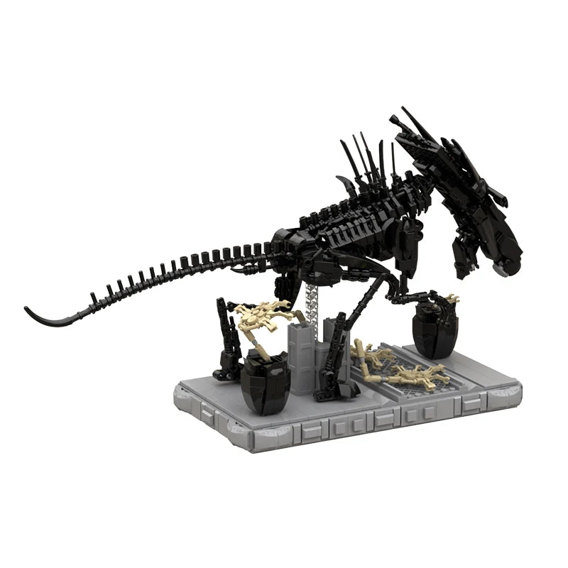 Alien Xenomorph Building Block Model featuring a detailed black Xenomorph figure standing on a grey base, displayed on a wooden desk next to a laptop and a green plant, perfect for sci-fi and Alien franchise fans