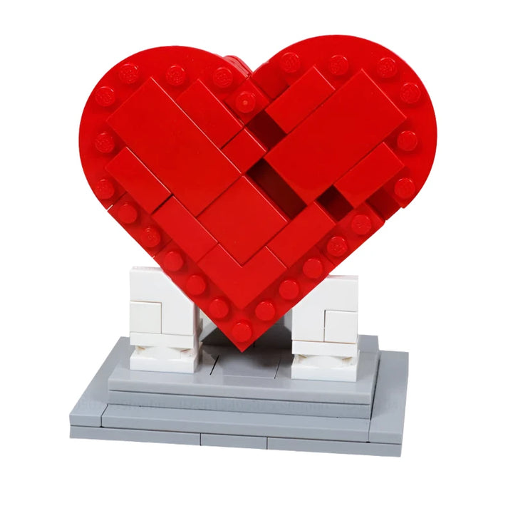 Heart Sculpture Building Blocks Set featuring a vibrant red heart design on a sturdy gray base, made from 105 interlocking pieces.