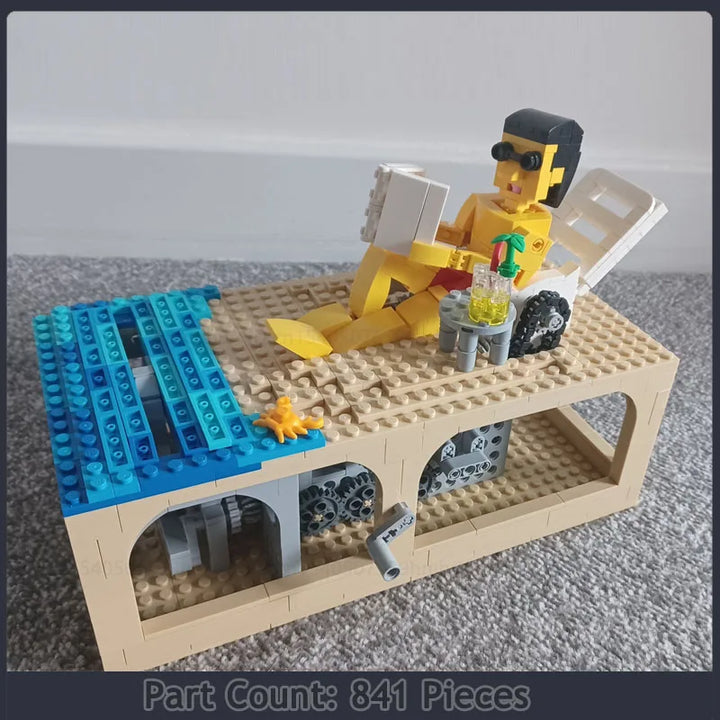 Oblivious Beach Scene Building Blocks Set with 841 Pieces, featuring a sunbather lounging by the pool, detailed deck chair, and vibrant summer colors, perfect for kids and adults