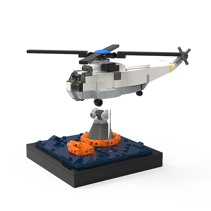 Rescue Helicopter Building Block Model featuring a detailed white helicopter with a winch lowering a rescue buoy, displayed on a black base, perfect for aviation and rescue operation enthusiasts.