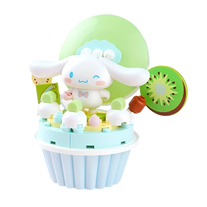 Sanrio Cinnamoroll Cartoon Cake Building Blocks Set featuring a cute anime figure of Cinnamoroll on a colorful cake, ideal for kids' toys, desktop ornaments, and birthday gifts.