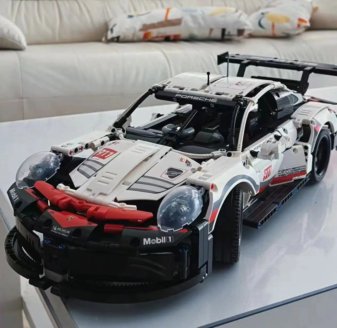 A highly detailed 2003-piece Porsche 911 Building Blocks Technology Super Sports Car Model featuring sleek aerodynamic lines, realistic cockpit, and engine bay, perfect for car enthusiasts and collectors.